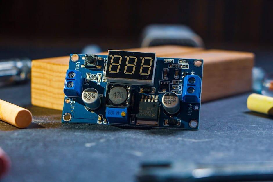 Detailed shot of an electronics circuit board featuring an LED display, perfect for tech and innovation content.