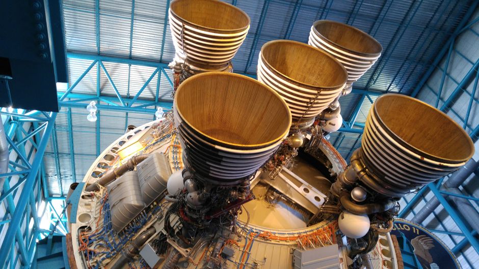 Detailed view of large rocket engines, showcasing intricate engineering and technology at a space museum.
