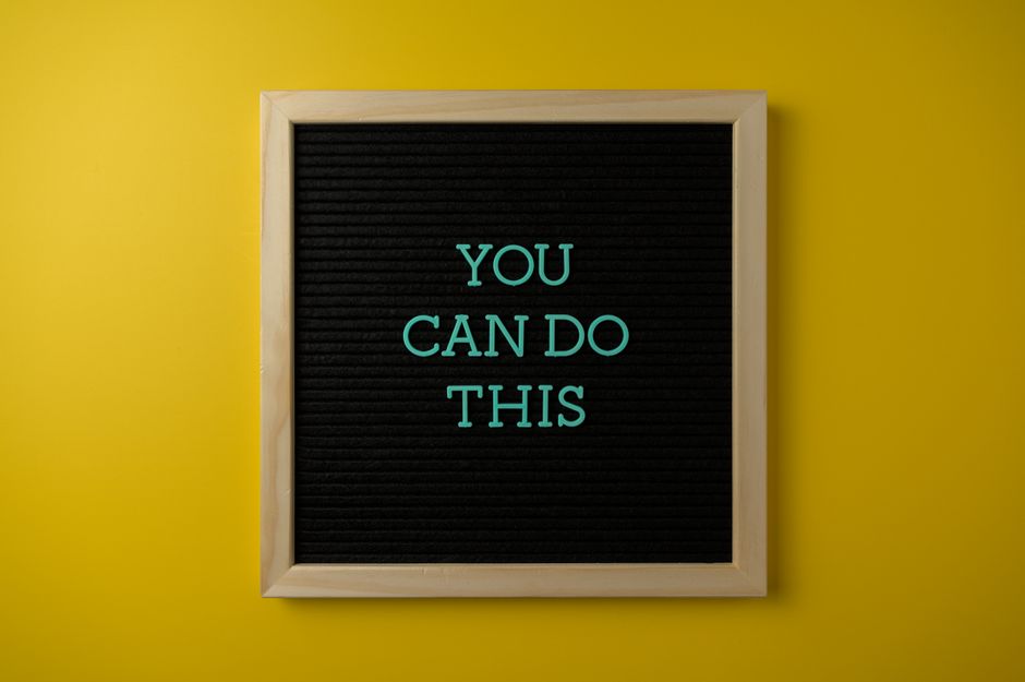 Inspirational message 'You Can Do This' displayed on a blackboard with a bold yellow backdrop.