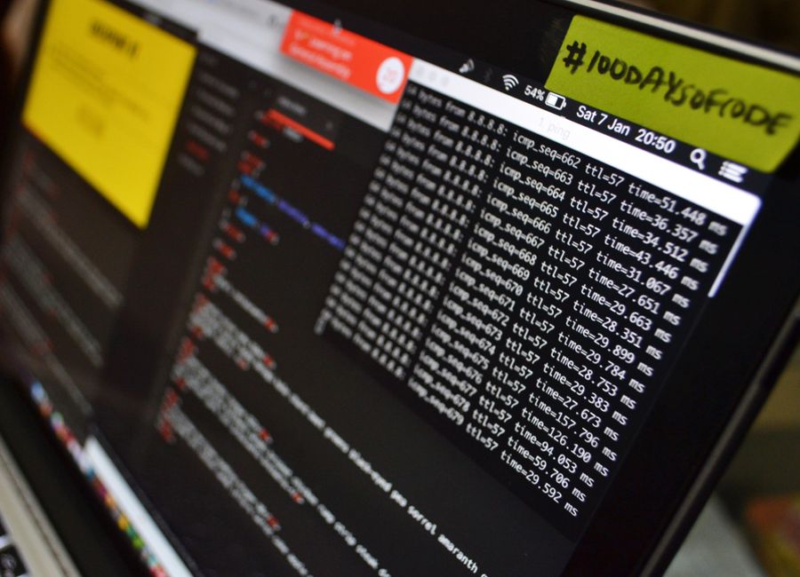 Macro shot of a laptop displaying coding and data analysis in progress. Ideal for tech themes.
